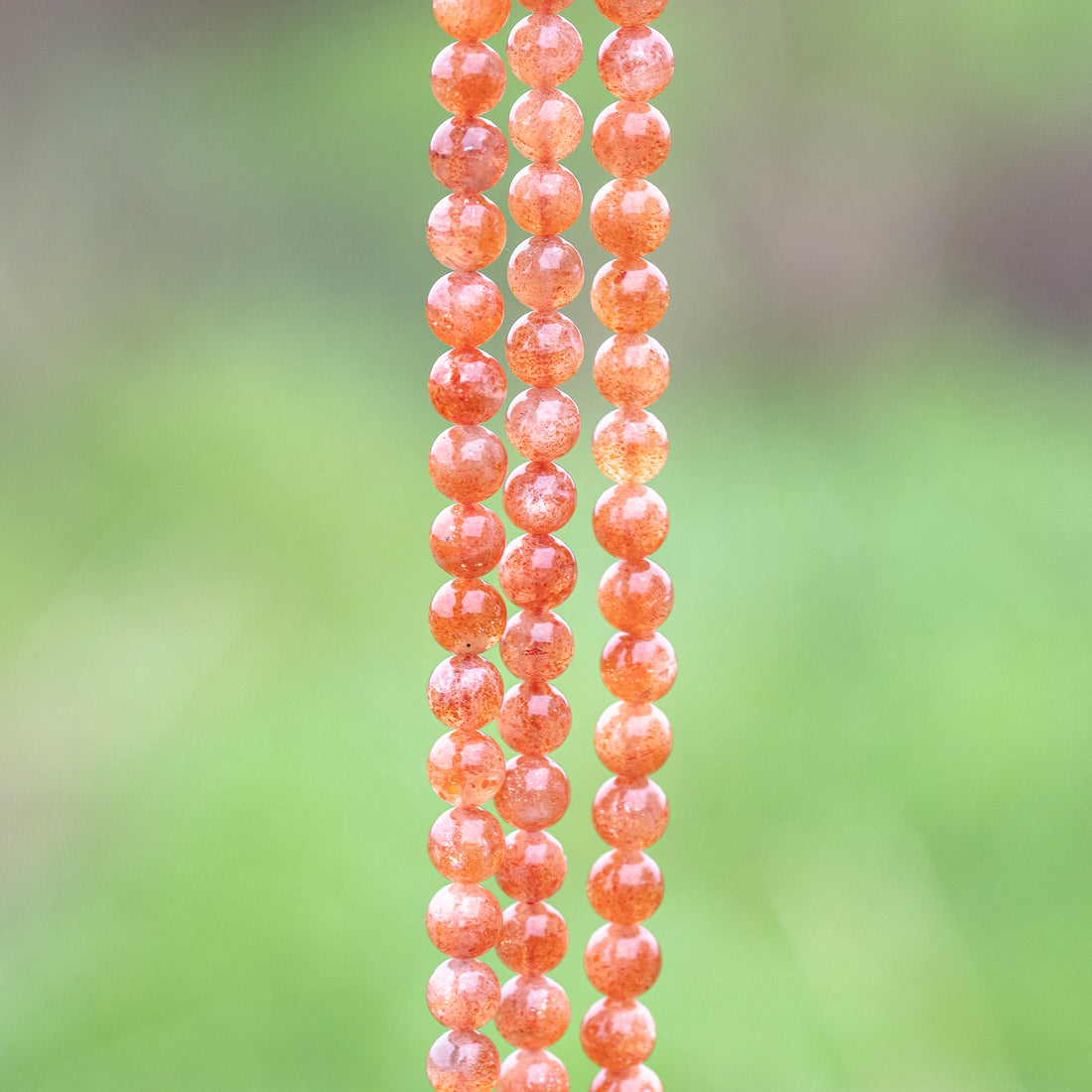 Perles rondes lisses de Pierre de soleil extra de 7 mm ( lot de 6 perles ou 1/2 rang )