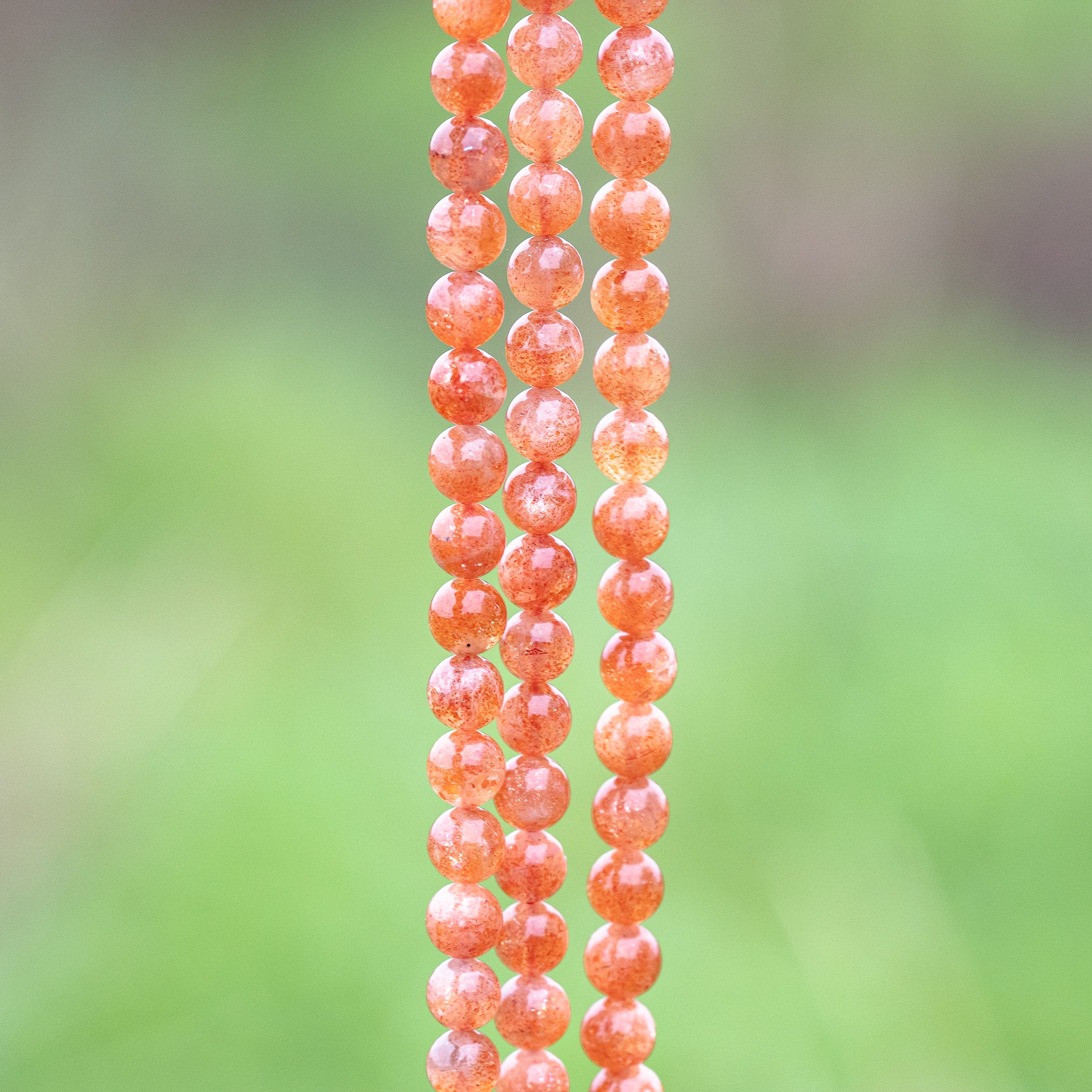 Perles rondes lisses de Pierre de soleil extra de 7 mm ( lot de 6 perles ou 1/2 rang )