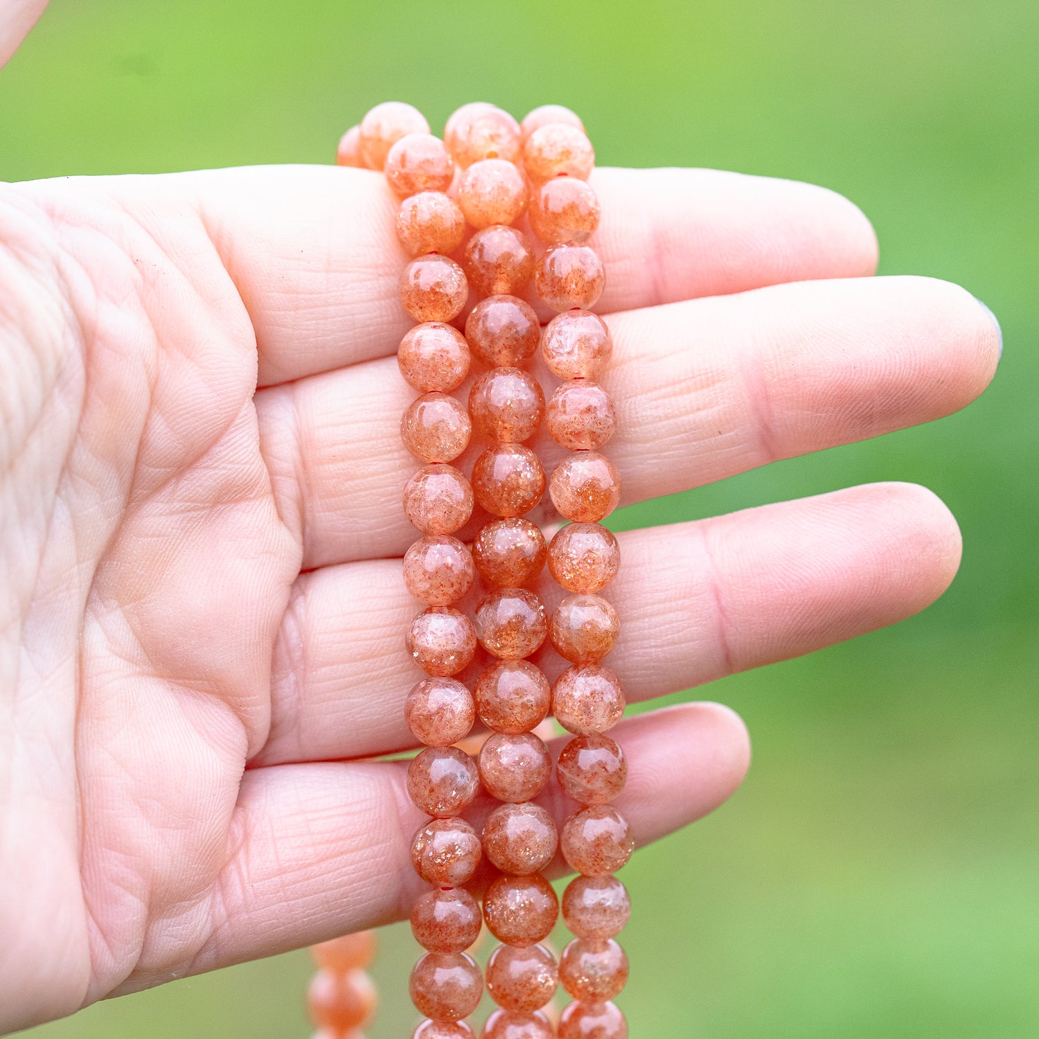 Perles rondes lisses de Pierre de soleil extra de 7 mm ( lot de 6 perles ou 1/2 rang )