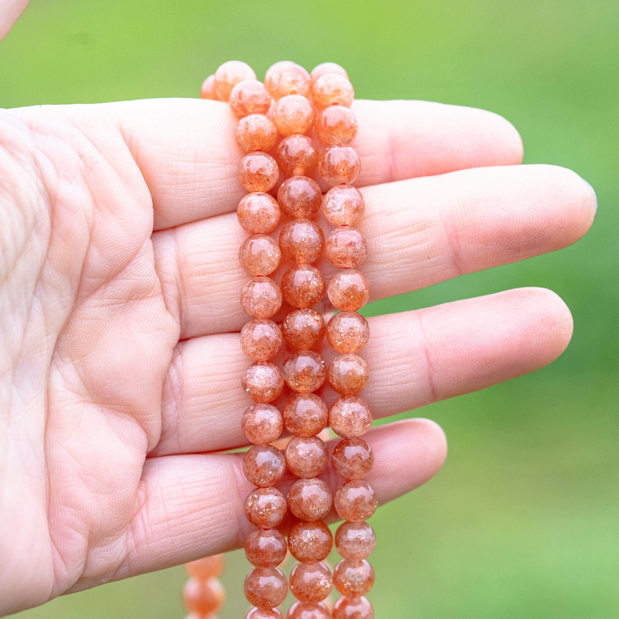 Perles rondes lisses de Pierre de soleil extra de 7 mm ( lot de 6 perles ou 1/2 rang )