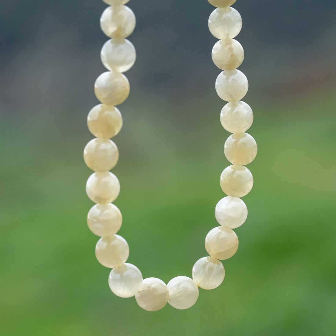 Perles rondes lisses de Calcite miel de 10 mm ( lot de 10 perles )