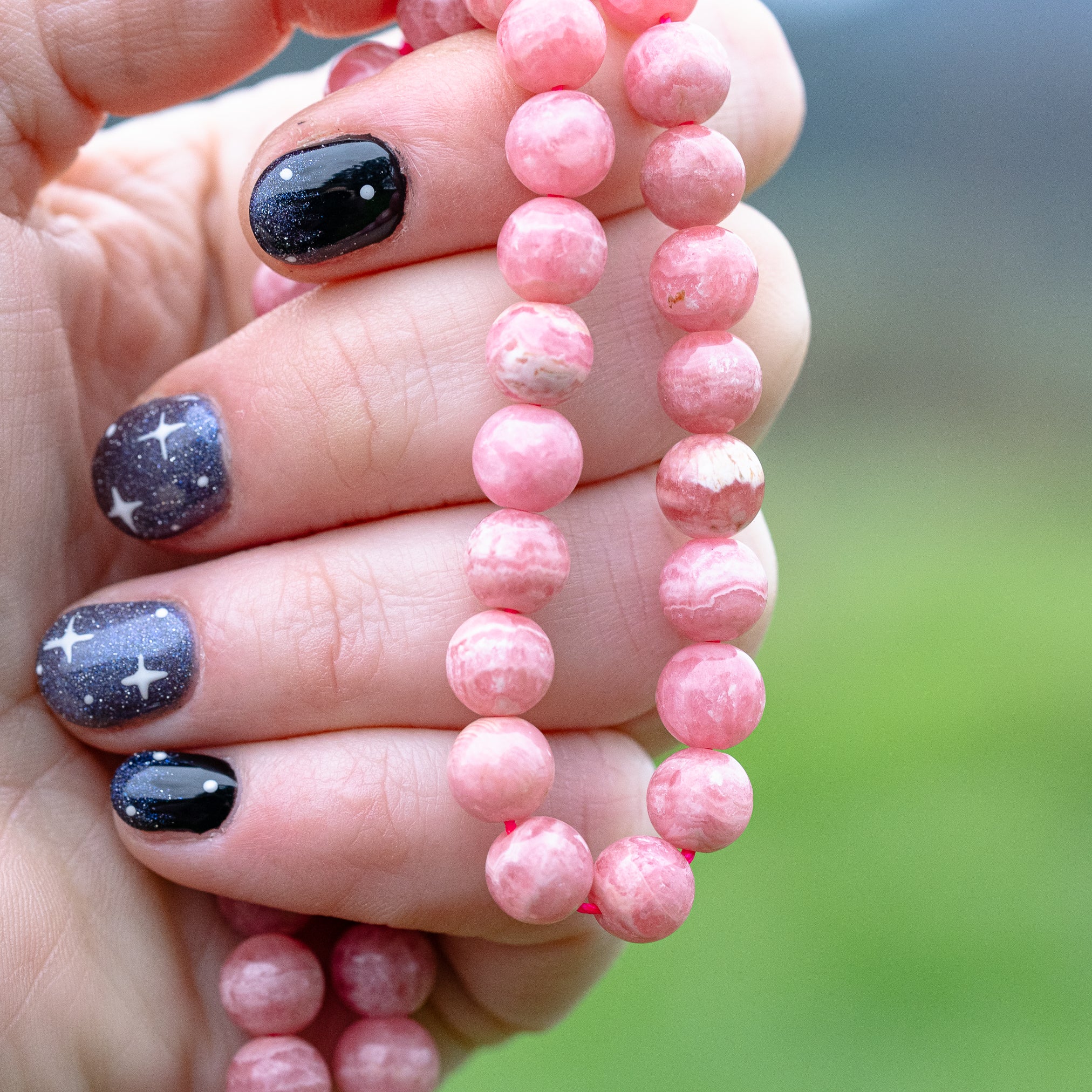 Perles rondes lisses de Rhodochrosite grade A de 8 mm ( Lot ou 1/2 rang )