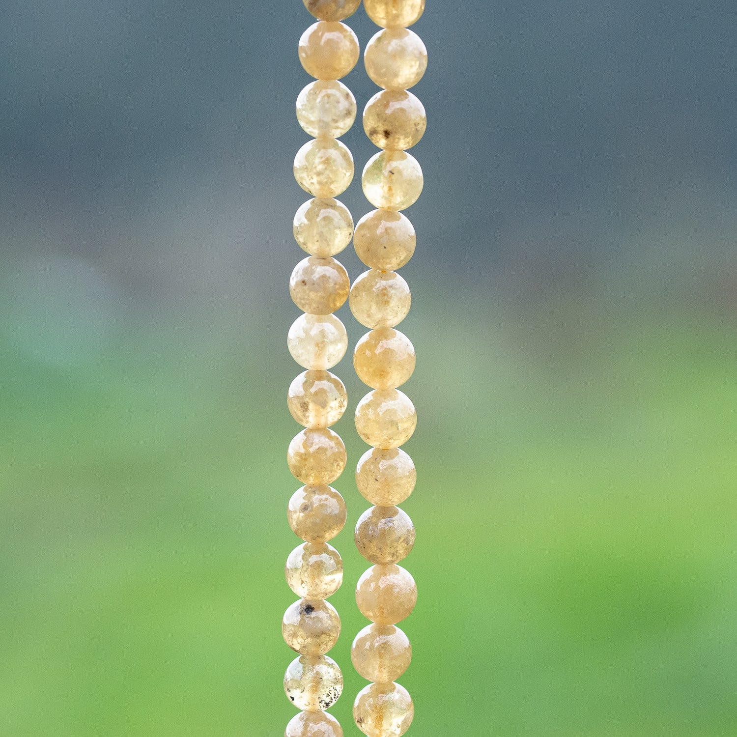 Perles rondes lisses de Grenat jaune de 7/8 mm ( 1/4 ou 1/2 rang )