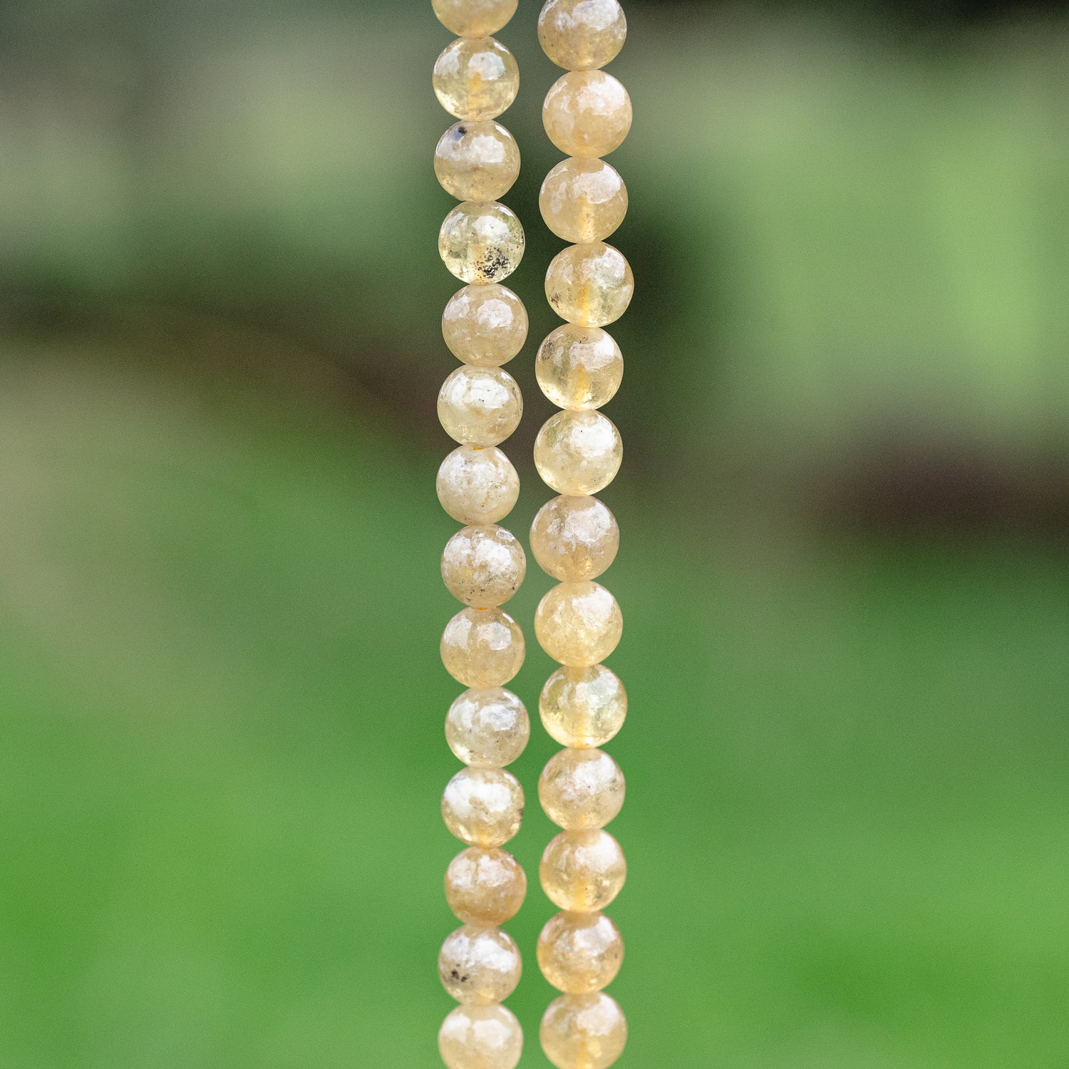 Perles rondes lisses de Grenat jaune de 7/8 mm ( 1/4 ou 1/2 rang )