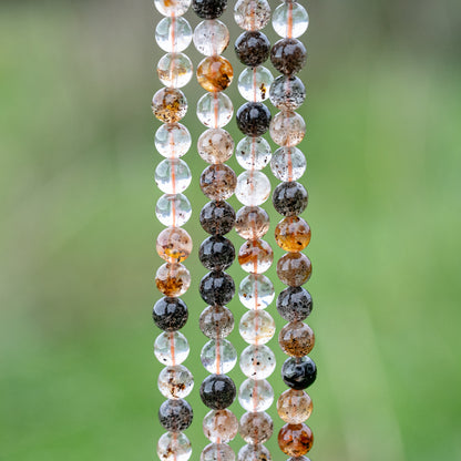 Perles rondes lisses de Quartz hématoide à inclusions de 8 mm ( 1/2 rang de env 24 perles )