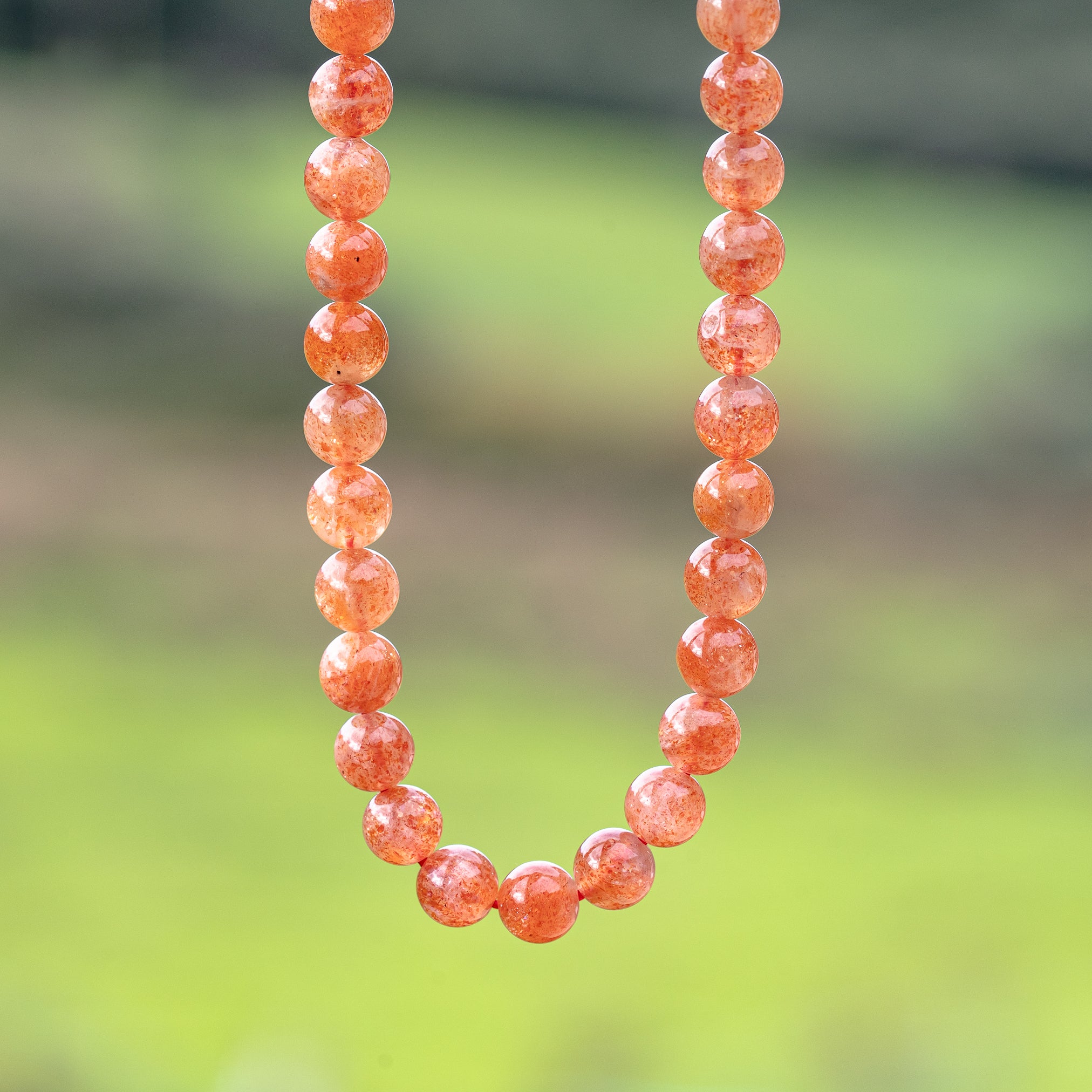 Perles rondes lisses de Pierre de soleil extra de 7 mm ( lot de 6 perles ou 1/2 rang )