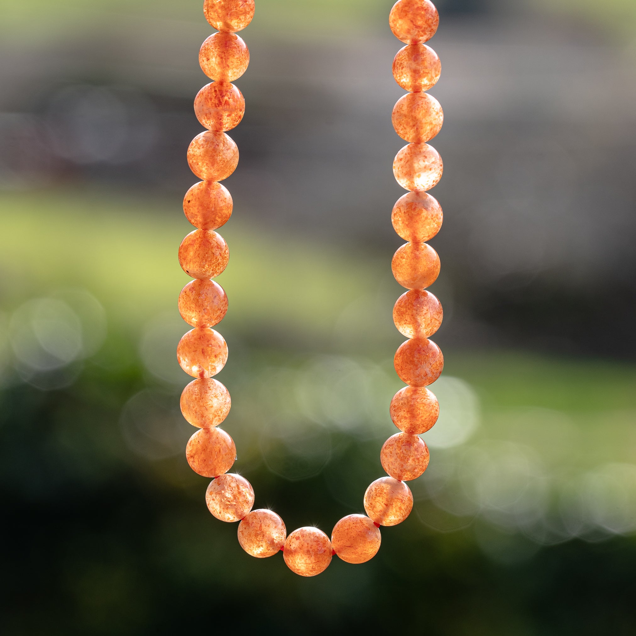 Perles rondes lisses de Pierre de soleil extra de 7 mm ( lot de 6 perles ou 1/2 rang )