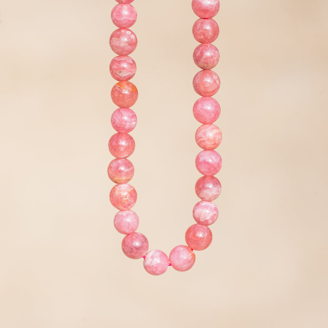 Perles rondes lisses de Rhodochrosite grade A de 8 mm ( Lot ou 1/2 rang )
