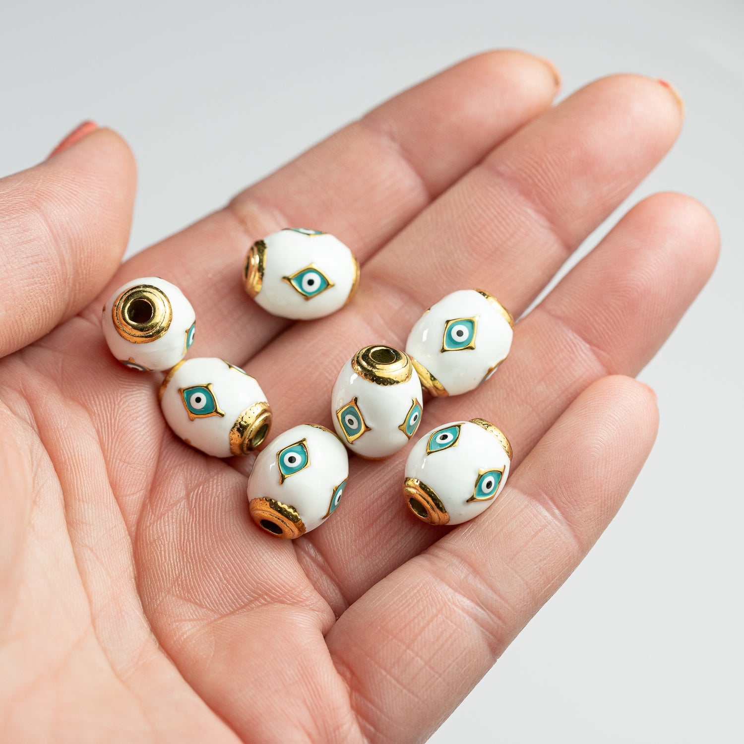 Perles ovales émaillées oeil en acier inox plaqué or 18K de 14,5 mm ( à l&