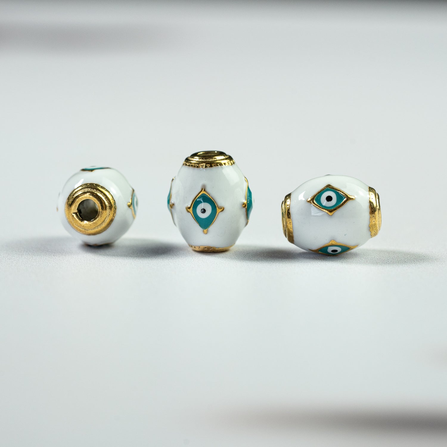 Perles ovales émaillées oeil en acier inox plaqué or 18K de 14,5 mm ( à l&