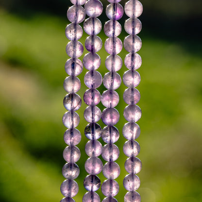 Perles rondes lisses en Améthyste violet clair de 8,5 mm ( rang de env 46 perles )