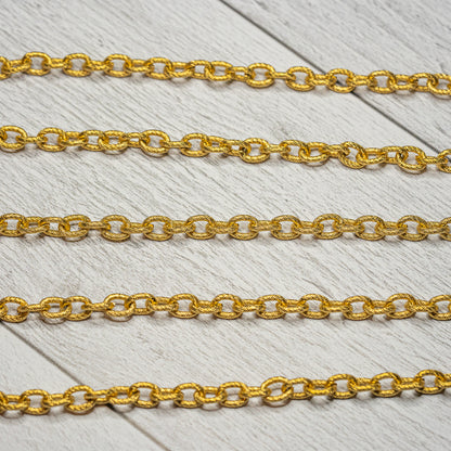 Chaine fantaisie texturée en acier inoxydable plaqué or 18k de 8 x 6 mm ( par 50 cm )