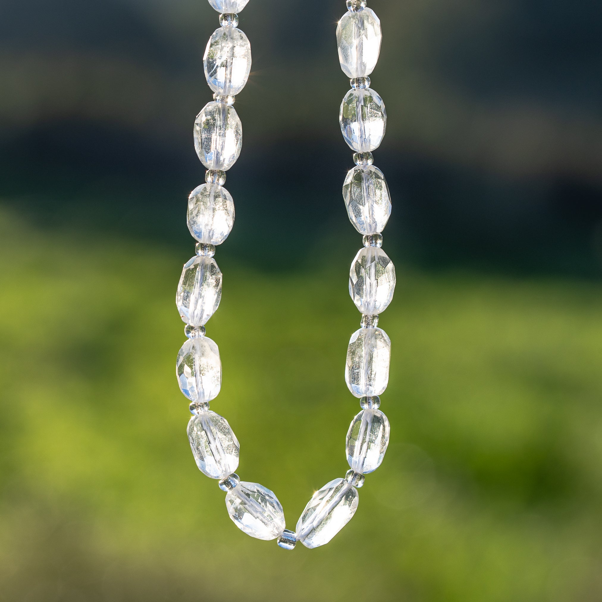 Perles ovales facettes de Cristal de roche de env 9/11 mm ( à l&