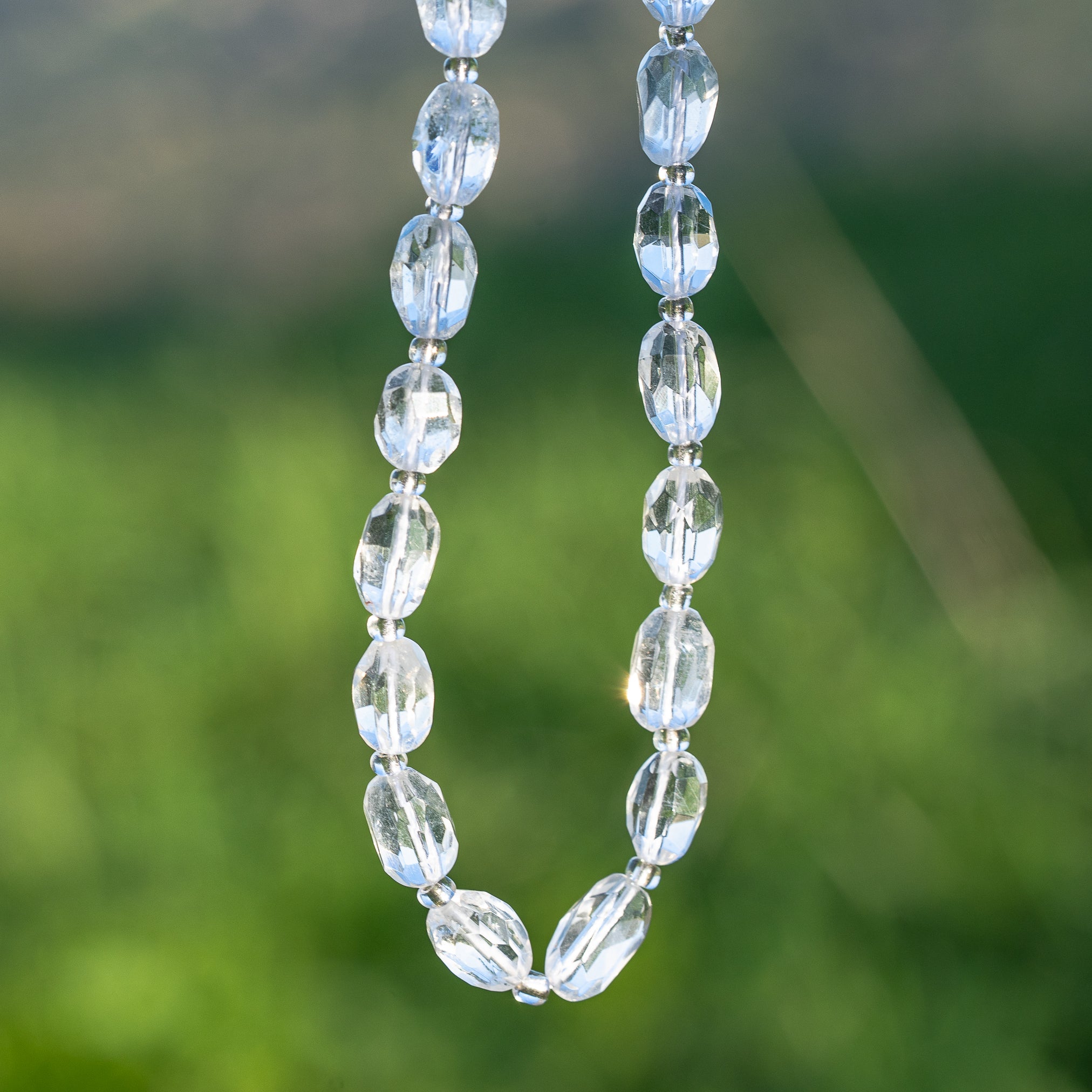 Perles ovales facettes de Cristal de roche de env 9/11 mm ( à l&