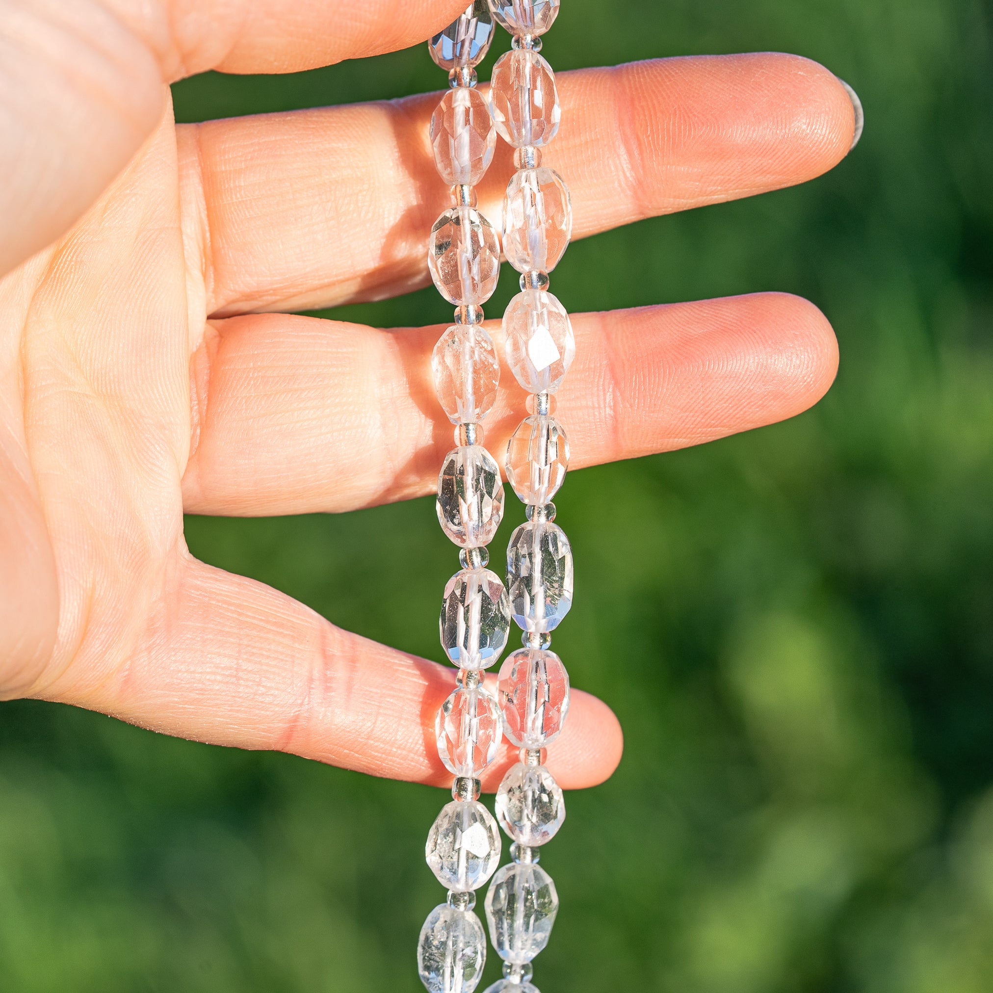 Perles ovales facettes de Cristal de roche de env 9/11 mm ( à l&