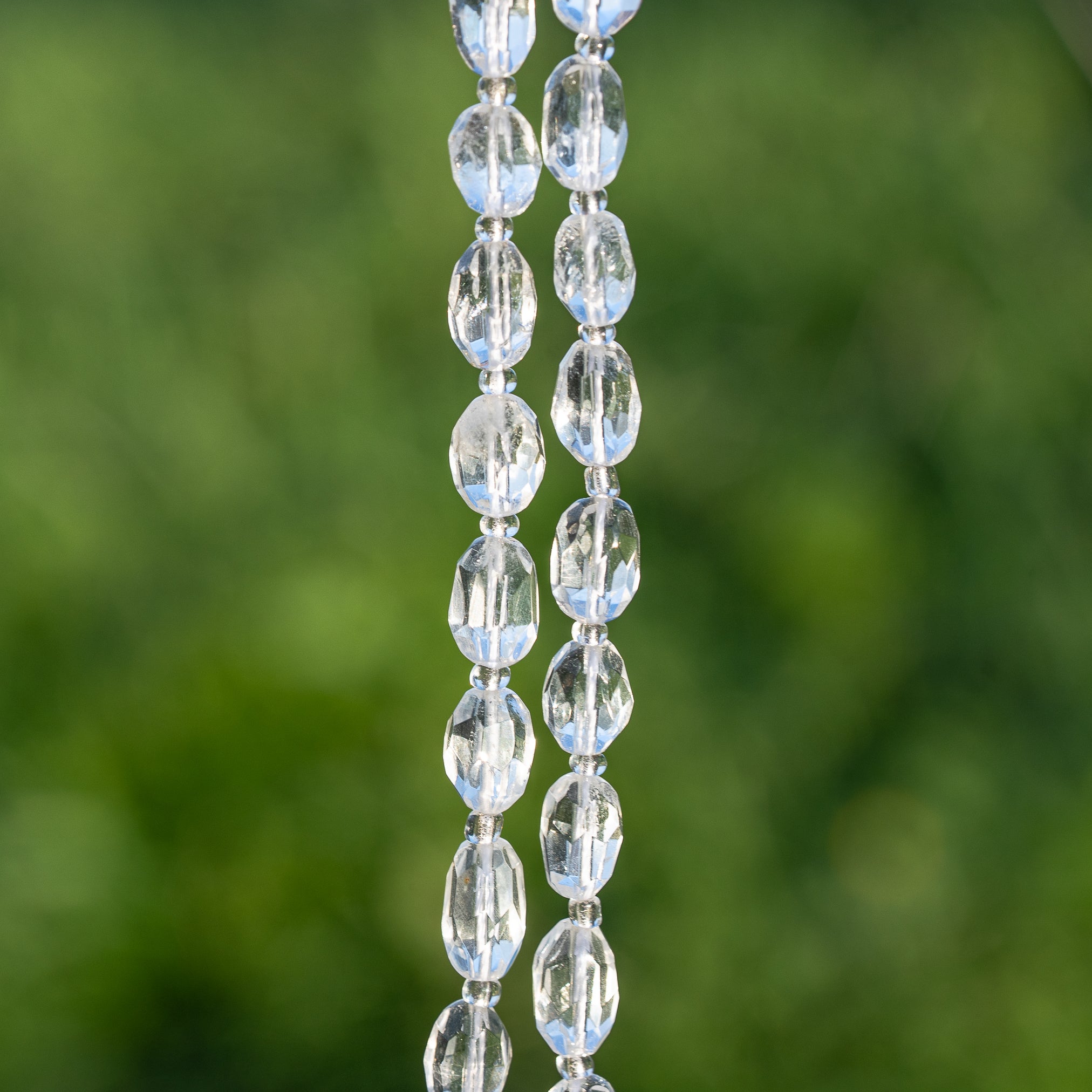 Perles ovales facettes de Cristal de roche de env 9/11 mm ( à l&