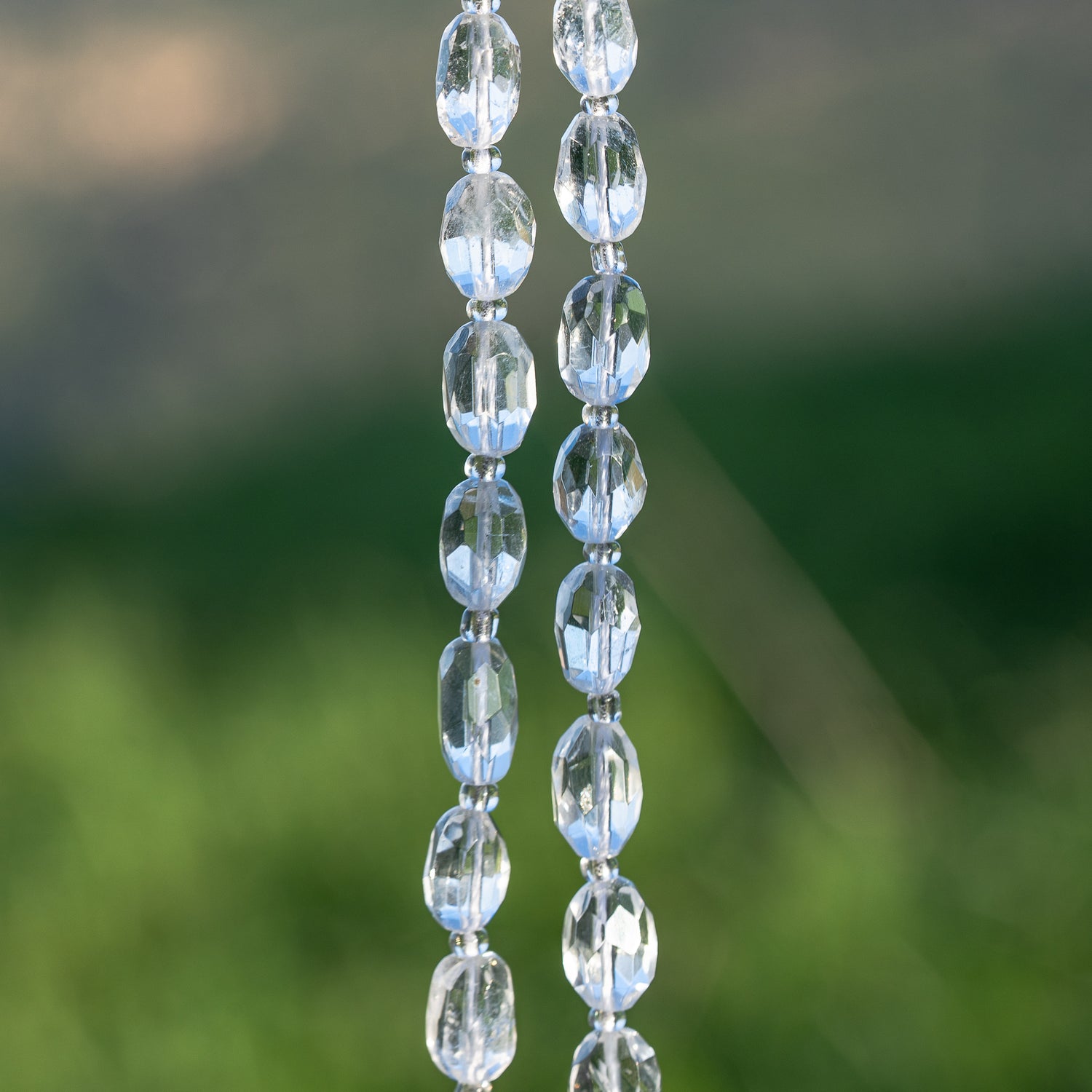 Perles ovales facettes de Cristal de roche de env 9/11 mm ( à l&