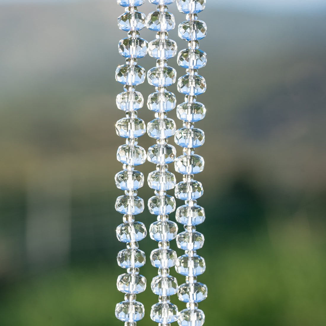 Perles rondelles facettes de Cristal de roche clair de env 7,5 x 5 mm ( 1/2 rang de env 28 perles )