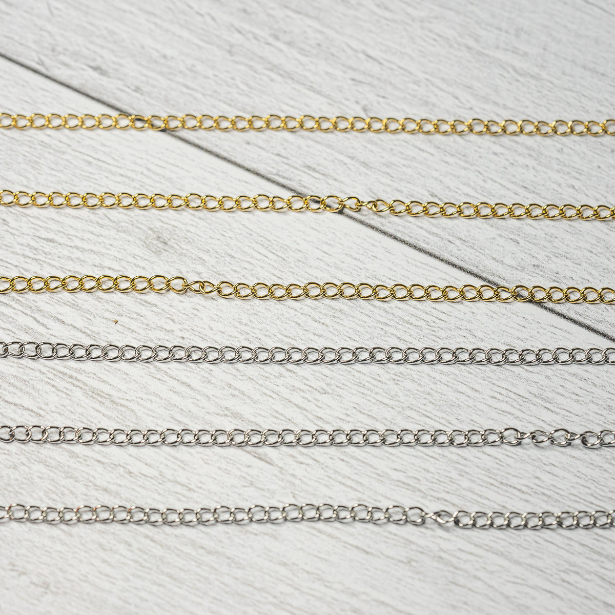 Chaine torsadée en acier inoxydable plaqué or 18k ou couleur acier ( au mètre )