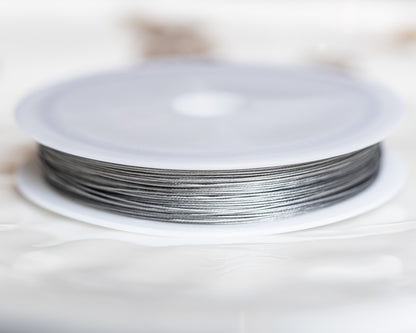 Fil câblé en acier inoxydable argenté de 0,38 mm ( bobine de 60 mètres )