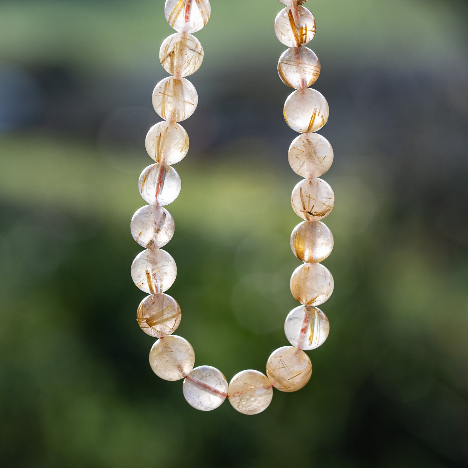 Perles rondes lisses de Quartz Rutile doré de 8,7 mm ( 1/4 de rang de env 11 perles )