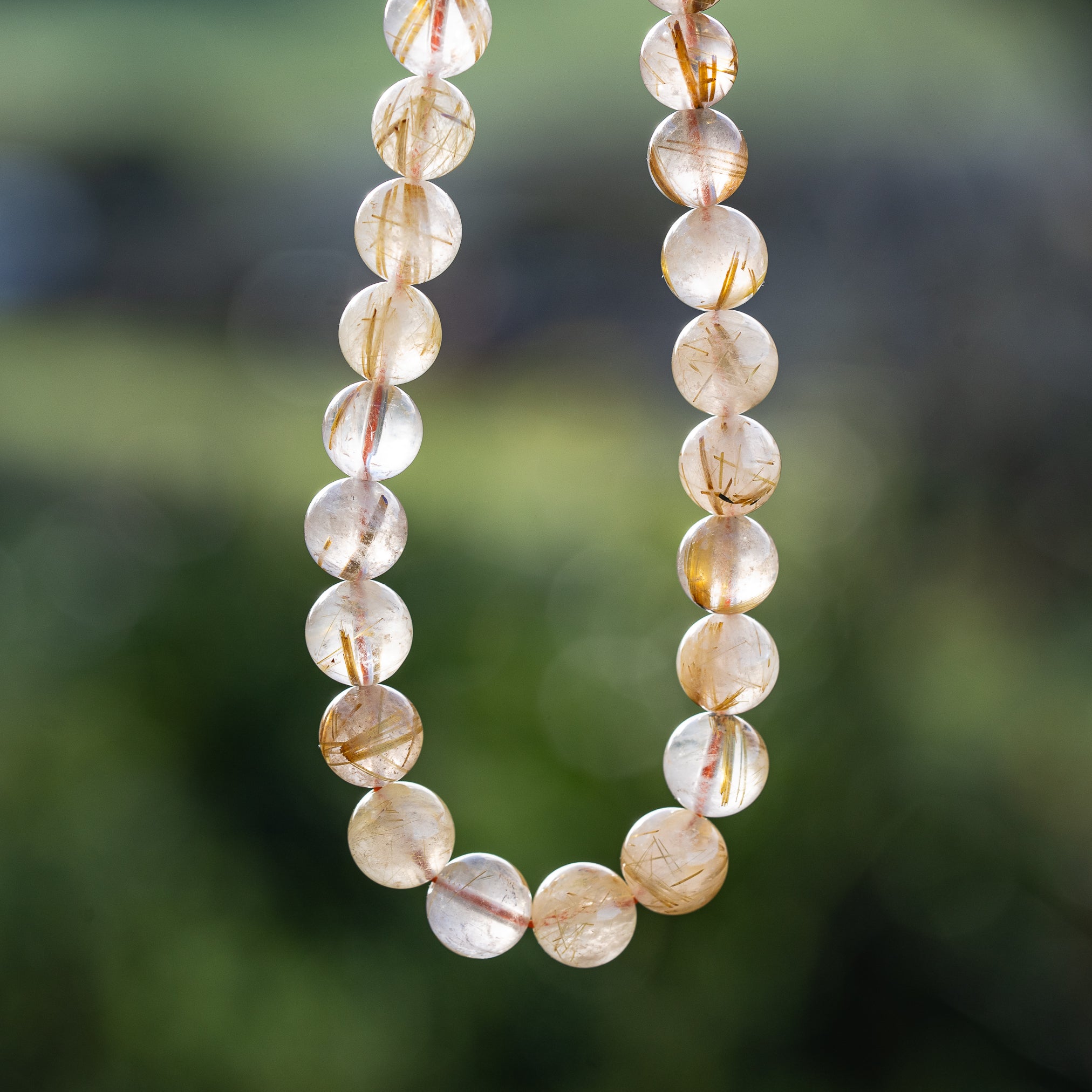 Perles rondes lisses de Quartz Rutile doré de 8,7 mm ( 1/4 de rang de env 11 perles )