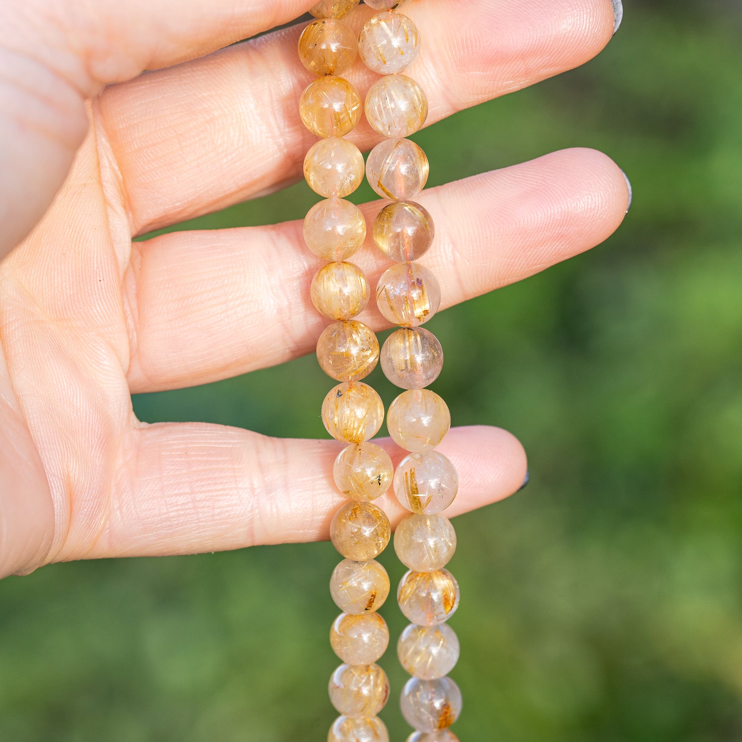 Perles rondes lisses de Quartz Rutile doré de 8,7 mm ( 1/4 de rang de env 11 perles )