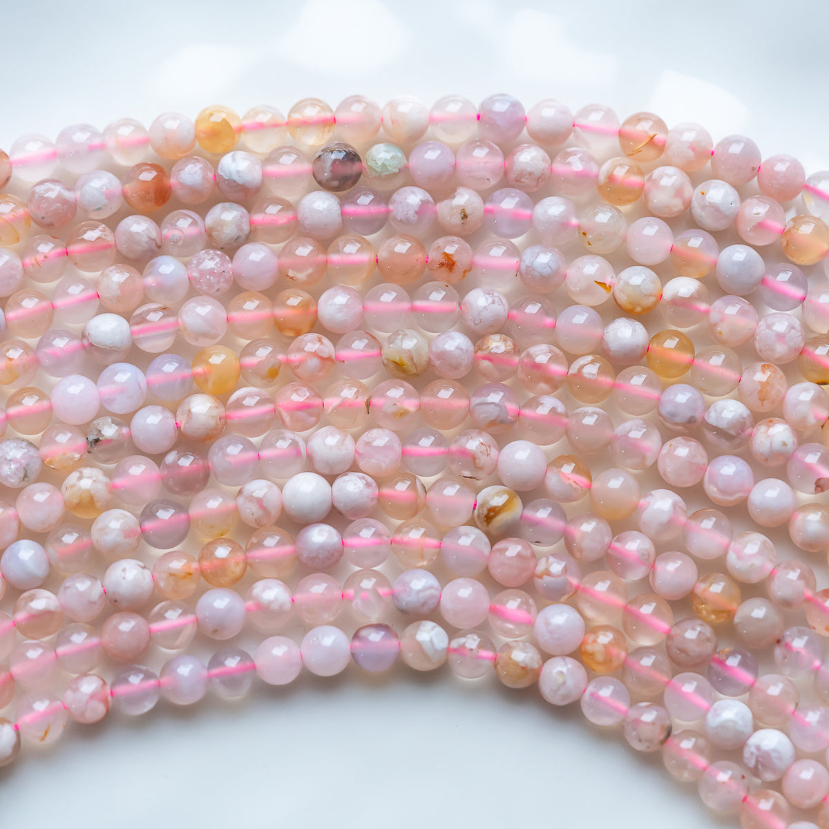 Perles rondes en lisses en Agate fleur de cerisier de 6,5 mm ( rang de env 59 perles )