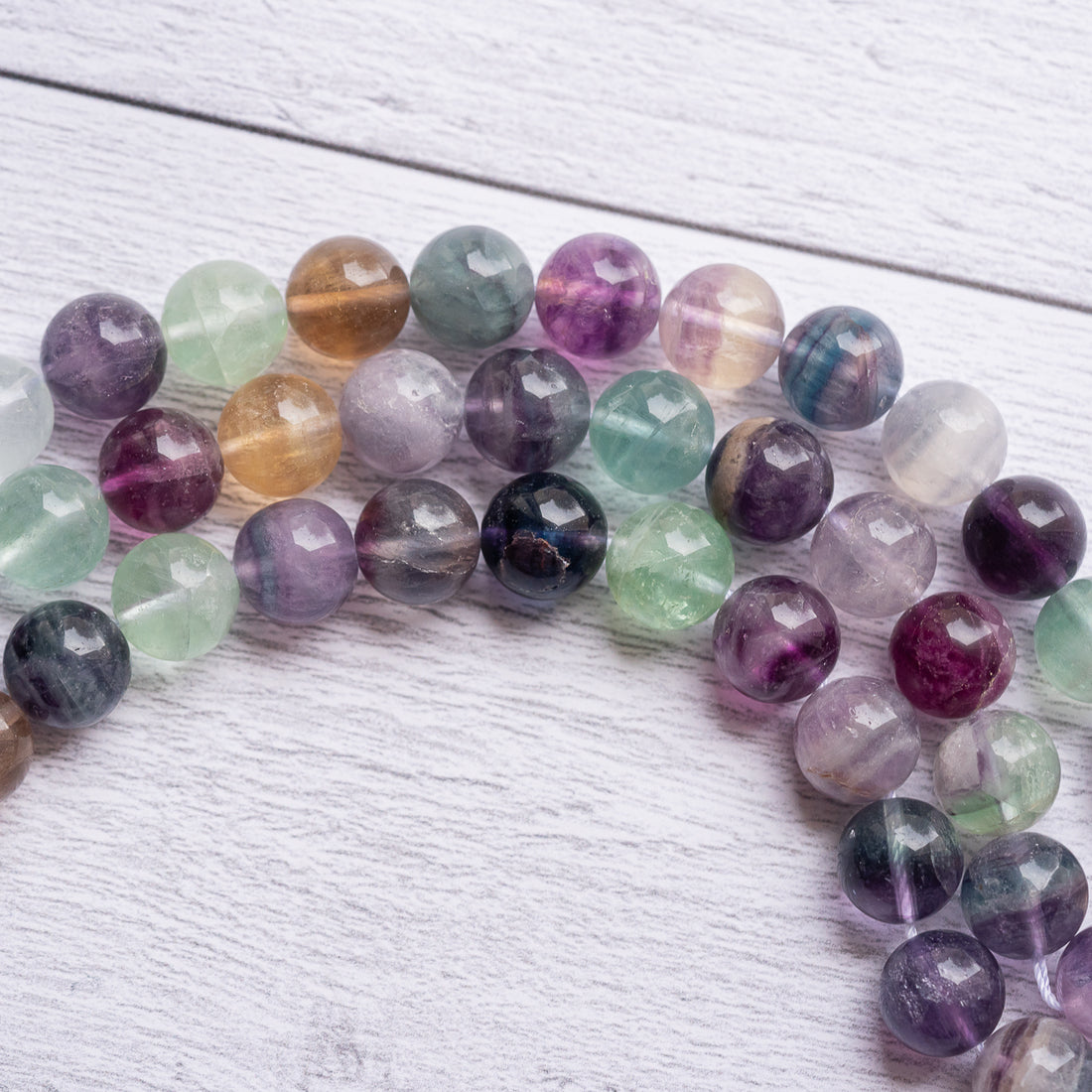 Perles rondes de Fluorite multicolore de 12,5 mm ( 1/2 rang de env 16 perles )