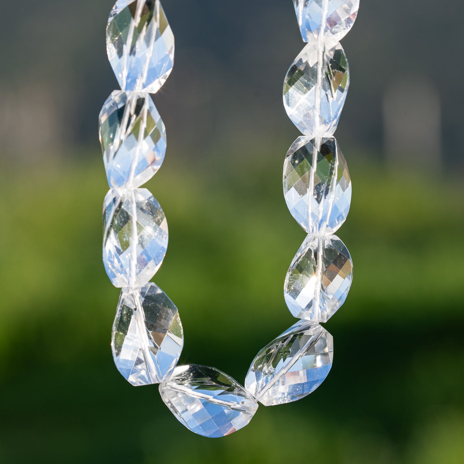 Perles torsadées facettes en cristal de roche clair de env 16/19 mm ( à l&