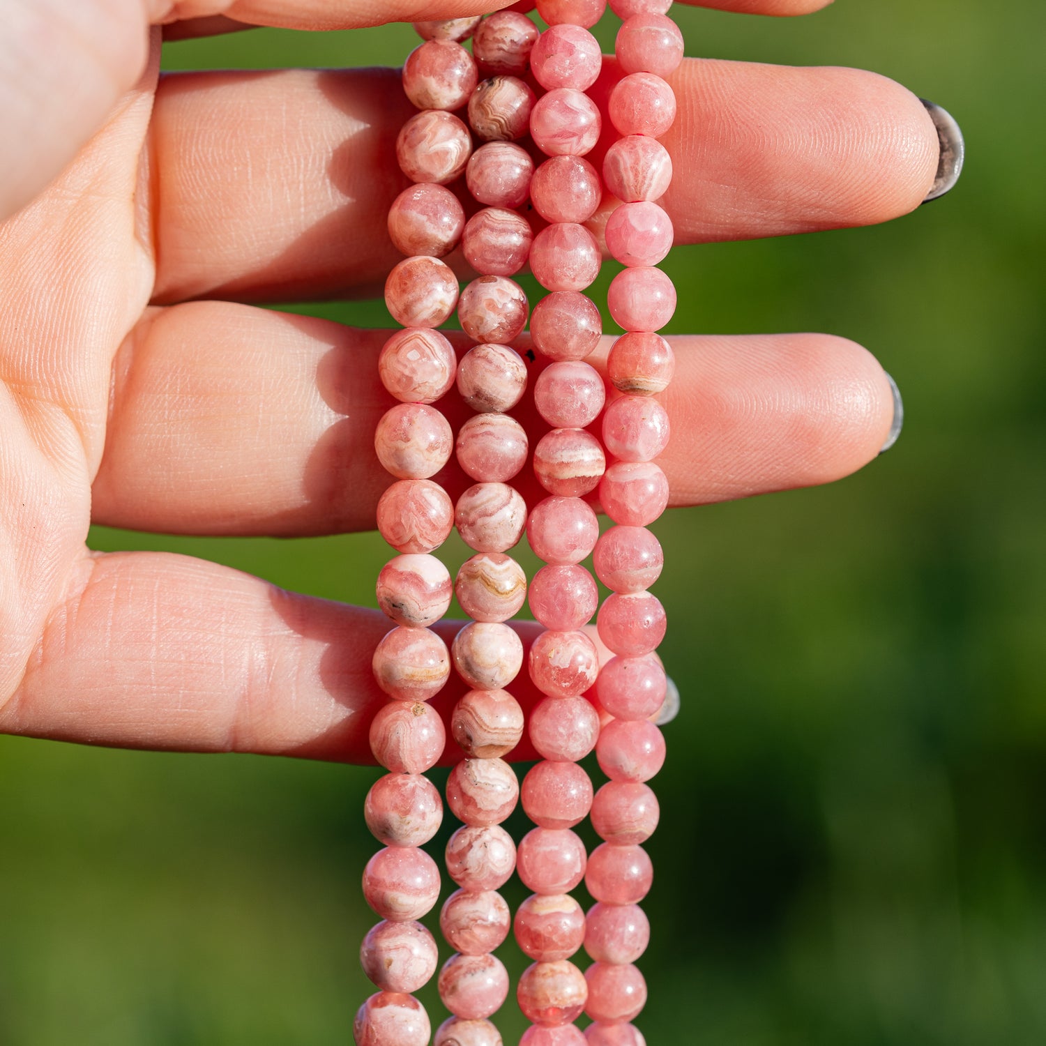 Perles rondes lisses de Rhodochrosite de 6/7 mm ( par 1/2 rang )