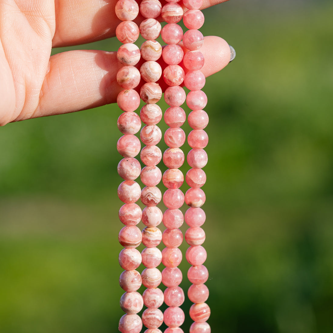 Perles rondes lisses de Rhodochrosite de 6/7 mm ( par 1/2 rang )