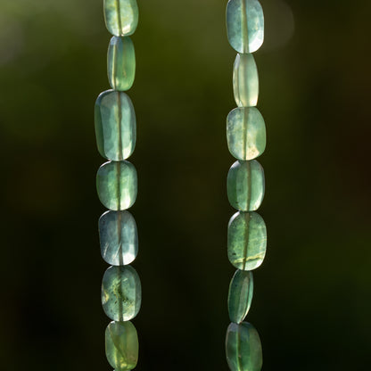 Perles ovales facettes de Serpentine de env 8/10 mm ( lot de 2 )
