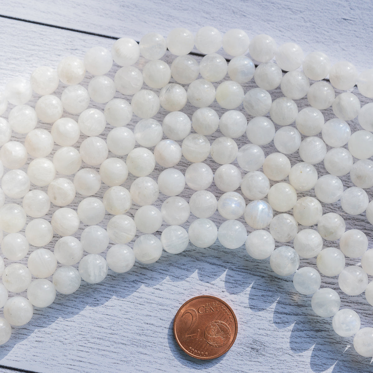 Perles rondes lisses de Labradorite blanche de 8/8,5 mm ( 1/2 rang de env 23/25 perles )