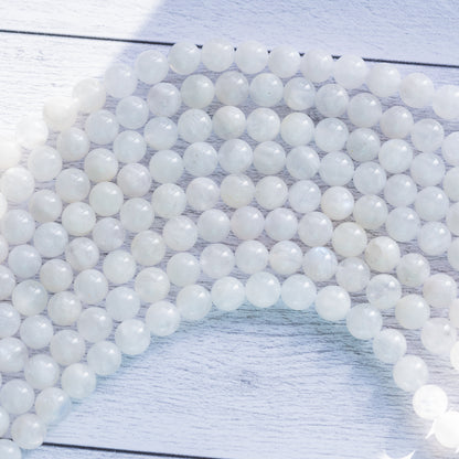 Perles rondes lisses de Labradorite blanche de 8/8,5 mm ( 1/2 rang de env 23/25 perles )