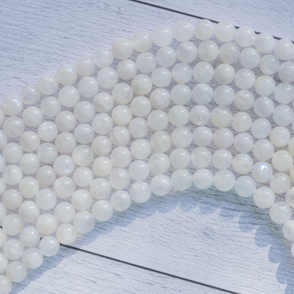 Perles rondes lisses de Labradorite blanche de 8/8,5 mm ( 1/2 rang de env 23/25 perles )