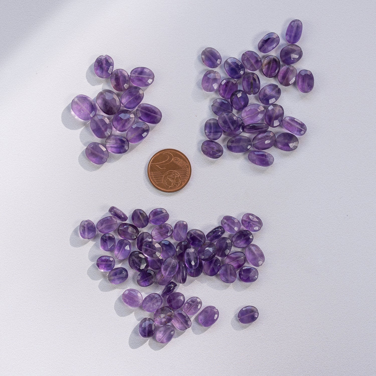 Perles ovales facettes en Améthyste de env 8/11 mm ( lot de 2 )