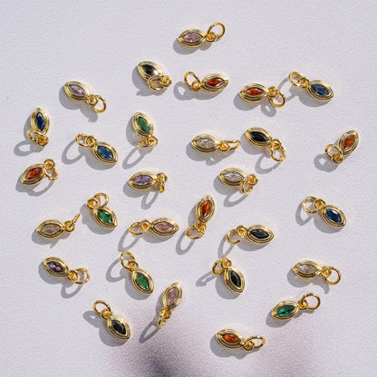 Petites breloques ovales/oeil en laiton plaqué or 18k et zirconium de 10 mm ( à l&