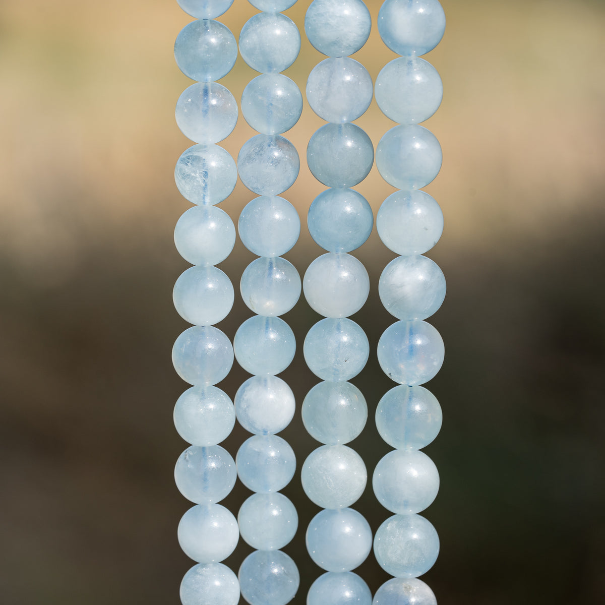 Perles rondes lisses en Aigue-marine de 9,5/10,5 mm ( lot de 10 perles )