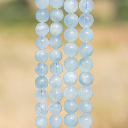 Perles rondes lisses en Aigue-marine de 9,5/10,5 mm ( lot de 10 perles )