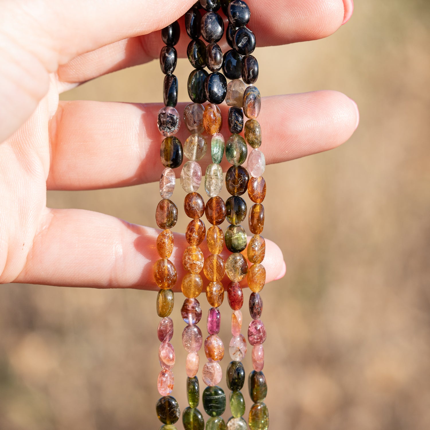 Rangs de 32 cm de perles ovales lisses de Tourmaline multicolore de env 5,5/7,5 mm