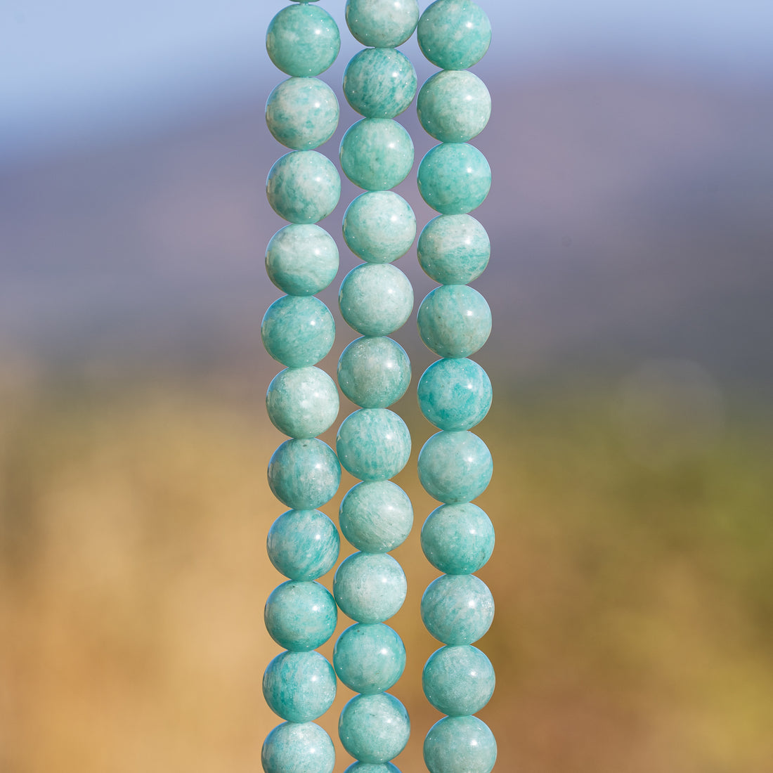 Perles rondes en Amazonite de 8,3 mm ( 1/2 rang de env 23 perles )