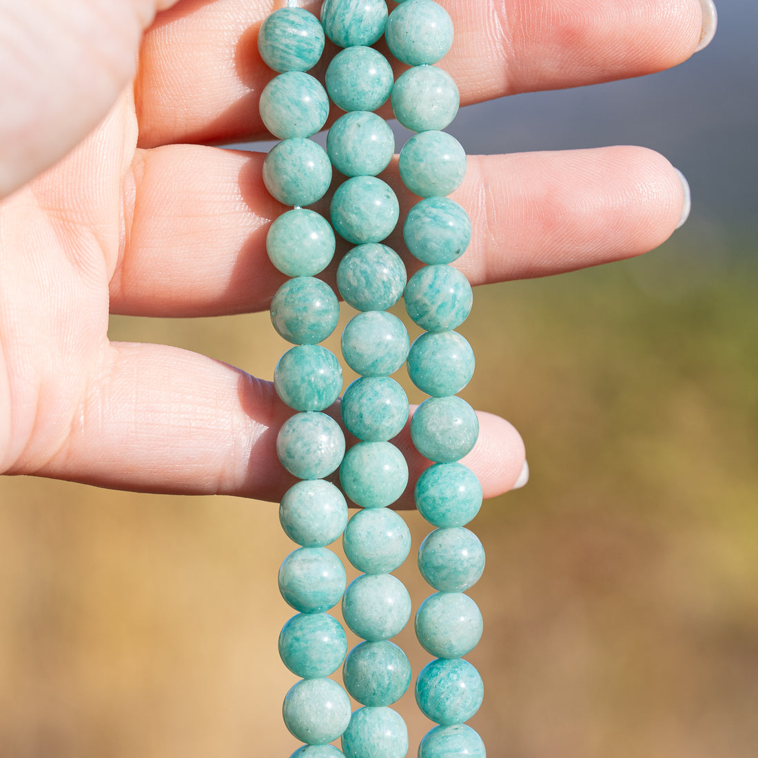 Perles rondes en Amazonite de 8,3 mm ( 1/2 rang de env 23 perles )