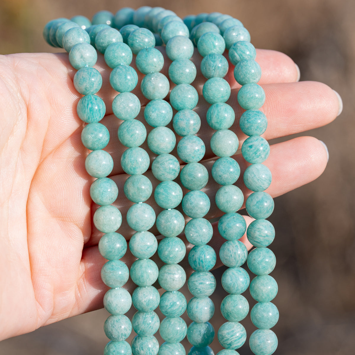 Perles rondes en Amazonite de 8,3 mm ( 1/2 rang de env 23 perles )