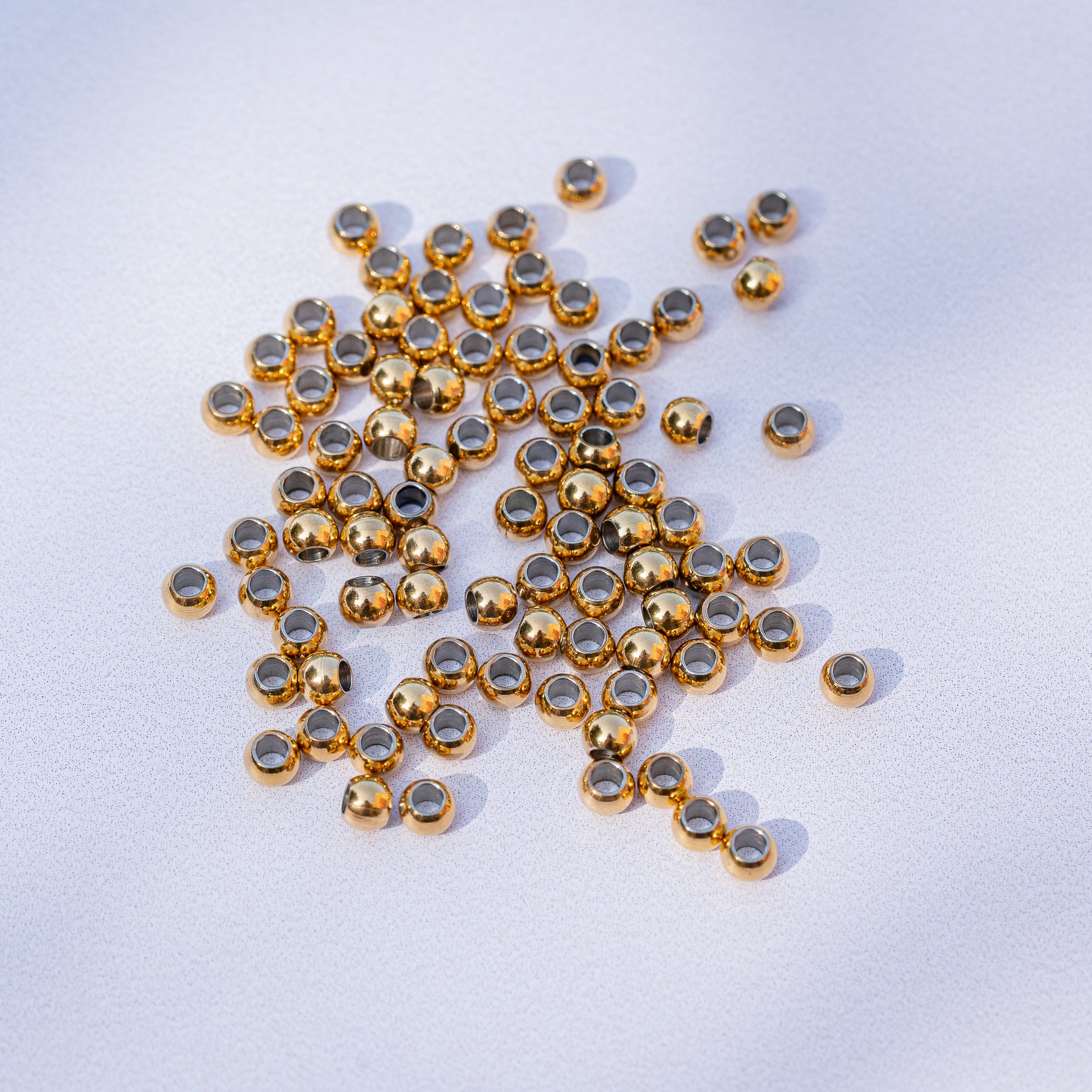 Perles rondes lisses en acier inoxydable doré de 4 x 3 mm ( lot de 10 )