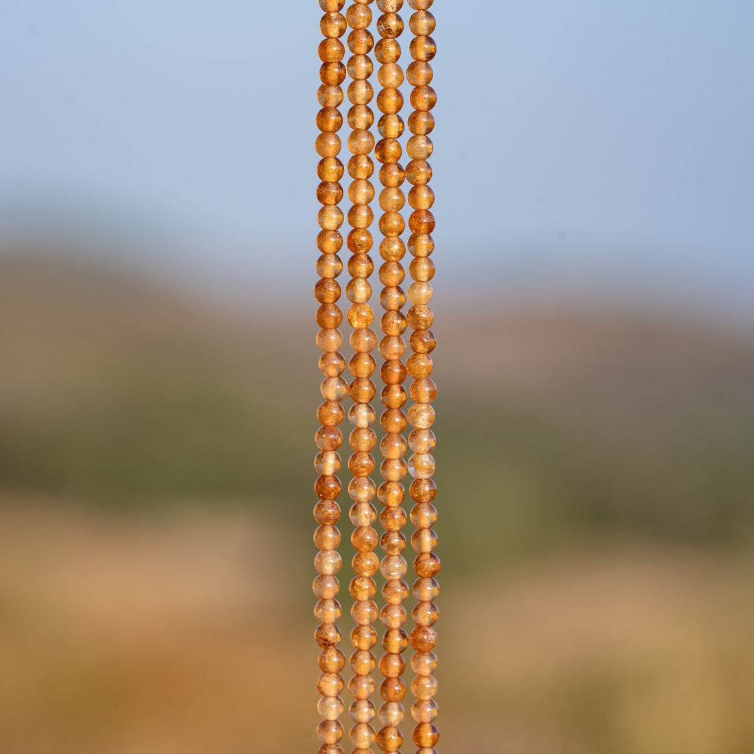 Perles rondes lisses de Grenat orange de 3 mm ( rang de env 144 perles )