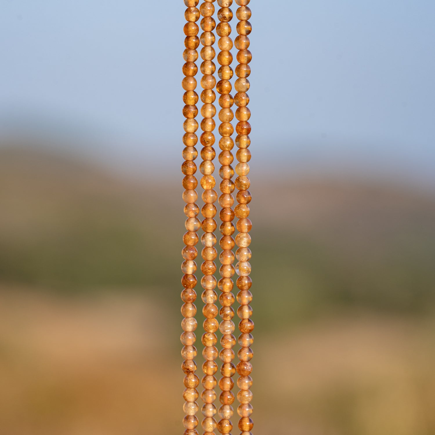 Perles rondes lisses de Grenat orange de 3 mm ( rang de env 144 perles )