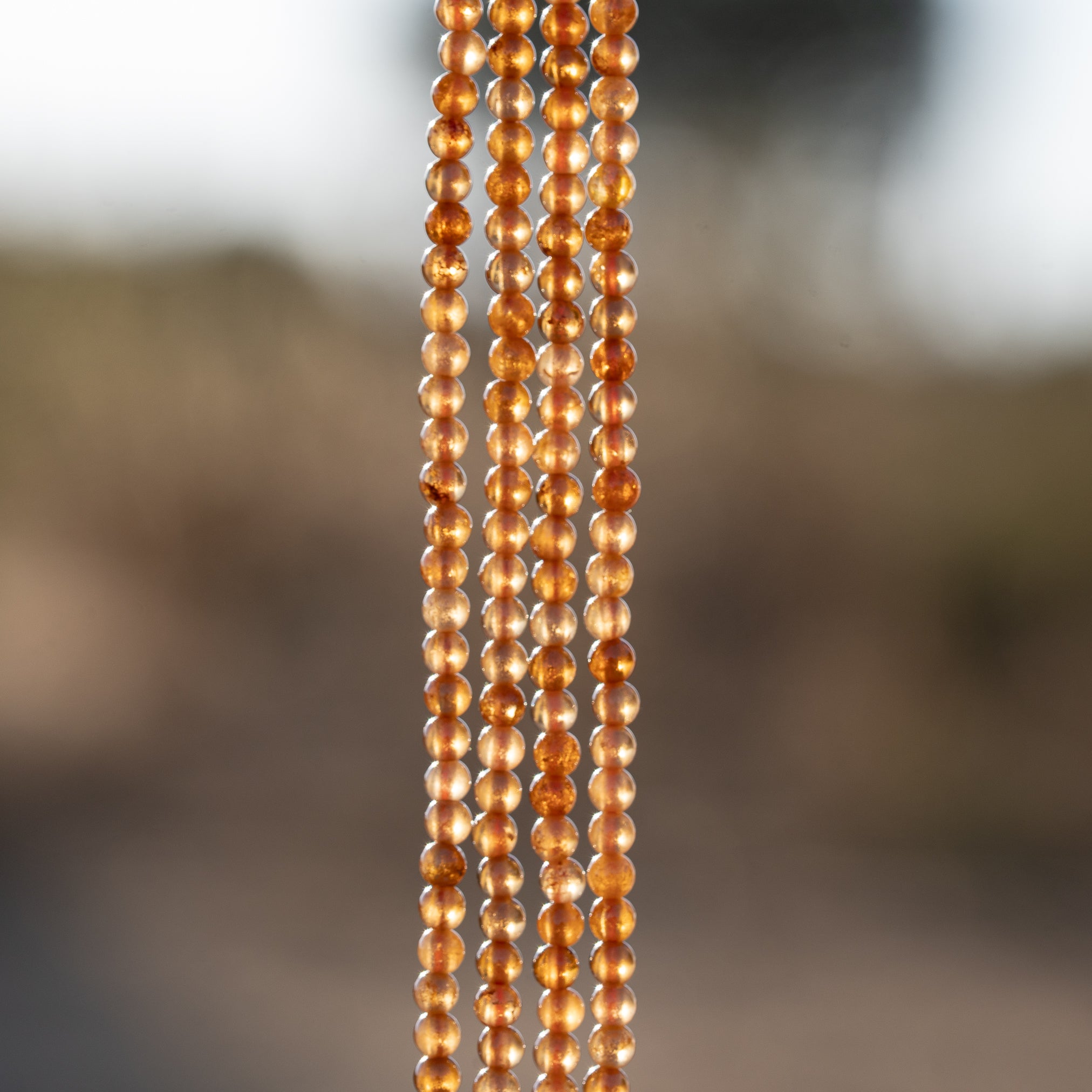 Perles rondes lisses de Grenat orange de 3 mm ( rang de env 144 perles )