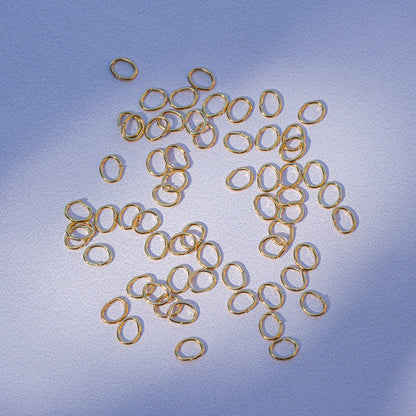 Anneaux de jonction ovales lisses en acier inox plaqués or 18k de 5,5 x 4 x 0,7 mm ( lot de 10 )