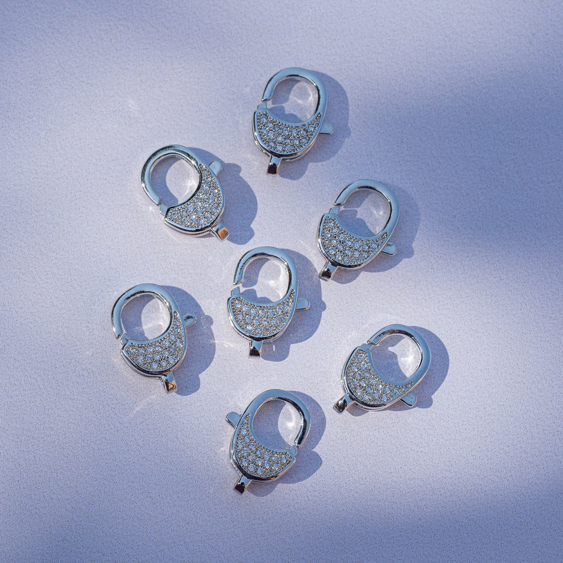 Fermoirs mousqueton ovales en laiton plaqué platine et zirconium de 16,5 mm ( à l&